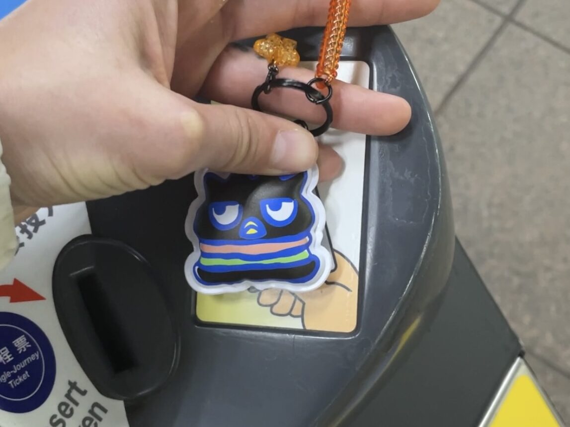 Image shows Bad-Badtz Maru, a Sanrio character, keychain being used as an entry pass for the MRT.